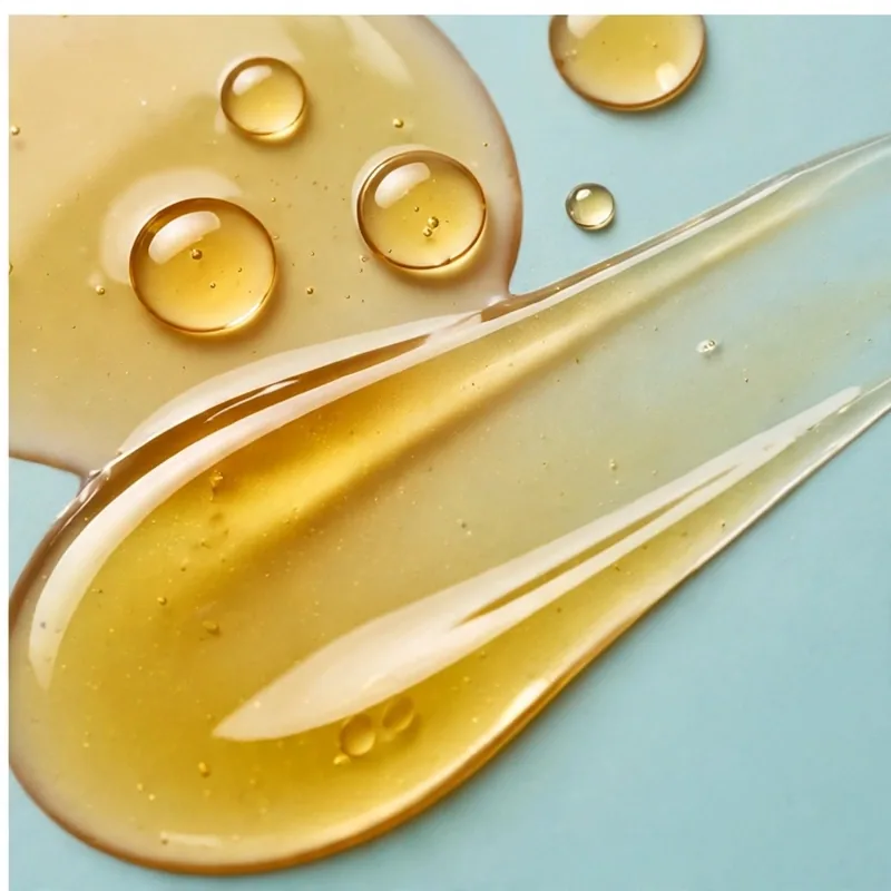Golden oil drops and a glossy smear of the Regenerating Youth Serum